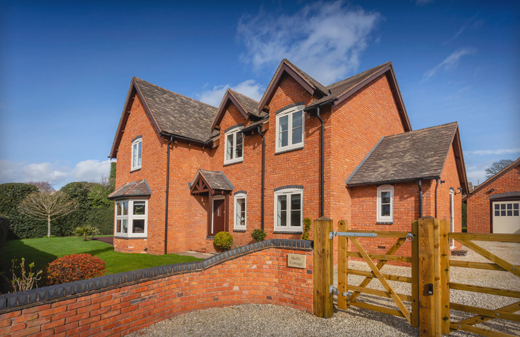 Red bricked out with Chartwell Green casement windows installed