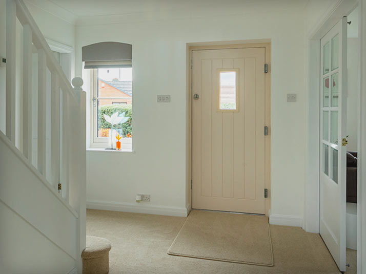 Internal view of a cream Composite Door and the stairwell
