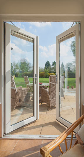 Modern log burner fireplace in the corner of a conservatory